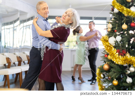 Elderly man and elderly woman dance waltz 134470673