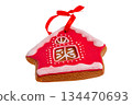 Gingerbread house with red ribbon isolated on white. 134470693