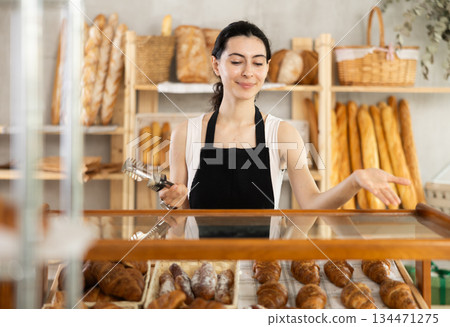 Armenian young woman work selling in family bakery shop 134471275