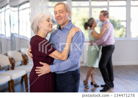 Elderly man and elderly woman dance waltz 134471278