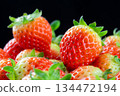 Heap Of Fresh Korean Strawberries Fruit On A Black Background. Close up 134472194