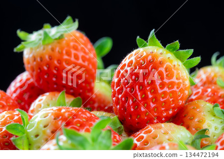 Heap Of Fresh Korean Strawberries Fruit On A Black Background. Close up 134472194