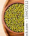 Raw mung bean in wooden bowl. Top view 134472212