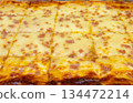 Cheese and slice ham lasagne on tray. Close up 134472214