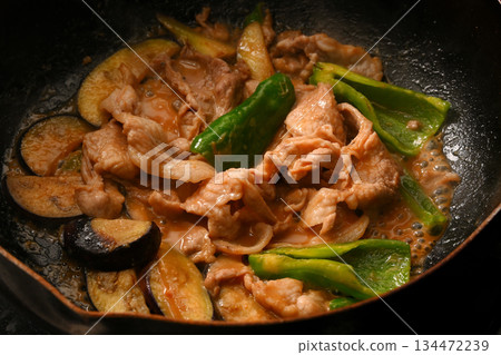 Stir-fried eggplant, green pepper, and pork with miso while cooking 134472239