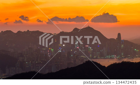 Golden Sunset Over City Skyline Behind Rolling Hills at Dusk Nov 10 2025 134472435