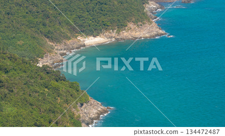 Nov 16 2025 Rocky Coastline with Waves under Blue Sky 134472487
