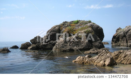 A beautiful coastline with beautiful ocean and strange rock formations 134472708