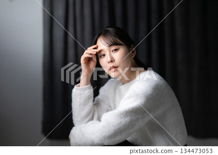 A woman relaxing in the room 134473053