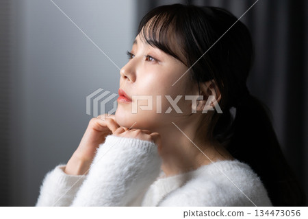 A woman relaxing in the room A woman relaxing in the room 134473056