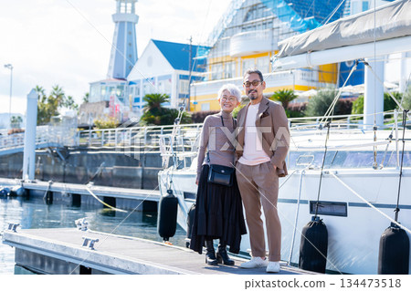 Senior couple traveling. Photo courtesy of Ito Marine Town Roadside Station. 134473518