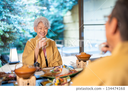 Senior women toasting at a ryokan Senior women toasting at a ryokan 134474168