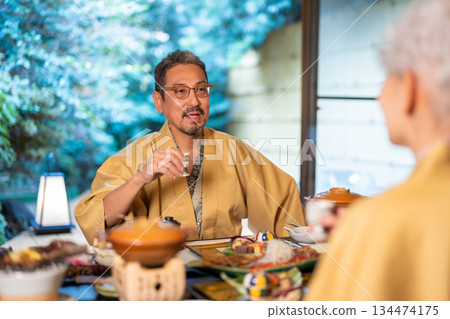 Senior couple toasting at a ryokan 134474175