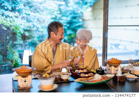 Senior couple eating at a hot spring inn 134474177