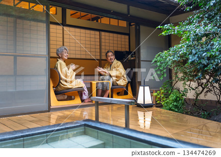 Senior couple relaxing at a traditional Japanese inn. Photo courtesy of Ito Ryokuyo. Senior couple relaxing at a traditional Japanese inn. Photo courtesy of Ito Ryokuyo. 134474269