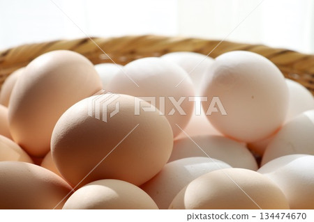 Two types of high-quality eggs on a colander Two types of high-quality eggs on a colander 134474670