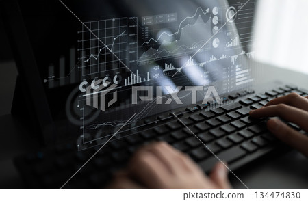Hands on keyboard working with digital financial graph and chart interface, data analysis for market trends and performance insights using modern technology Scalp Hands on keyboard working with digital financial graph and chart interface, data analysis for market trends and performance insights using modern technology Scalp 134474830