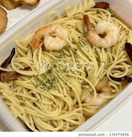 Gambas spaghetti with succulent shrimp, garlic, olive oil, and chili flakes a perfect fusion of seafood richness and Italian flavor in every bite. 134474856