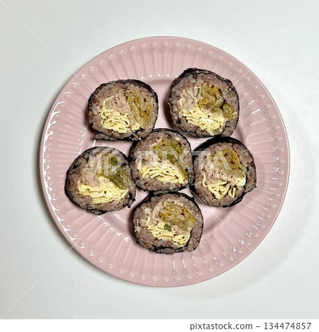 Delicious kimbap rolls filled with fresh vegetables, seasoned rice, and savory proteins, all wrapped in crisp seaweed. A perfect combination of flavor and texture in every bite. Delicious kimbap rolls filled with fresh vegetables, seasoned rice, and savory proteins, all wrapped in crisp seaweed. A perfect combination of flavor and texture in every bite. 134474857