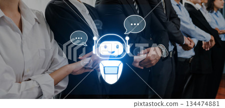 Business Team Collaboration with a Chatbot Icon Representing Communication in a Corporate Environment Trope Business Team Collaboration with a Chatbot Icon Representing Communication in a Corporate Environment Trope 134474881