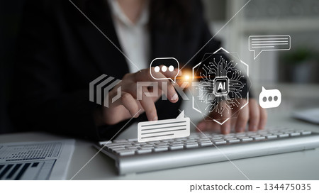 Business professional interacting with artificial intelligence technology on keyboard with digital icons representing smart communication and innovation Gantry Business professional interacting with artificial intelligence technology on keyboard with digital icons representing smart communication and innovation Gantry 134475035