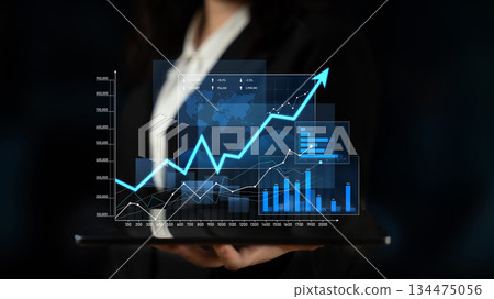 Businesswoman Presenting Data Visualizations with Growth Charts and Graphs on Tablet Against Dark Background for Financial Analysis and Reporting Scalp Businesswoman Presenting Data Visualizations with Growth Charts and Graphs on Tablet Against Dark Background for Financial Analysis and Reporting Scalp 134475056