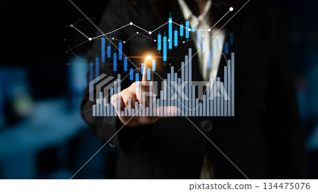 Business professional analyzing financial data on a digital screen with graphs and charts showcasing trends and market performance for investment analysis Scalp 134475076