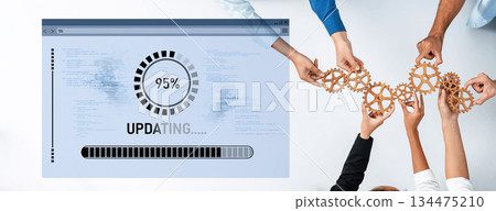 Hands Collaborating to Build a Gear Network with a Progress Bar Indicating Software Update Completion at 95 Percent in a Modern Workspace Environment Trope 134475210