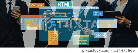 Business professionals collaborating on programming languages and technology concepts with digital graphics of coding languages like , HTML, and Trope 134475609