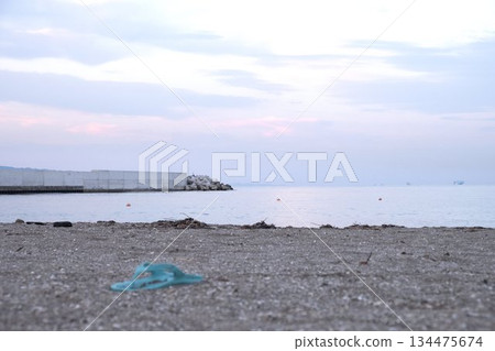 Beach sandals on the beach Beach sandals on the beach 134475674