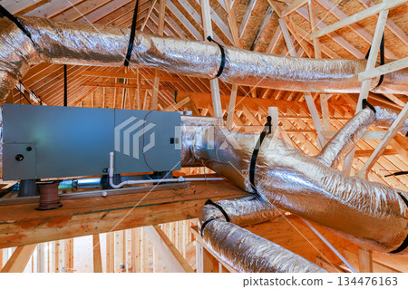 Workers install ventilation system in new building construction stage at residential area Workers install ventilation system in new building construction stage at residential area 134476163