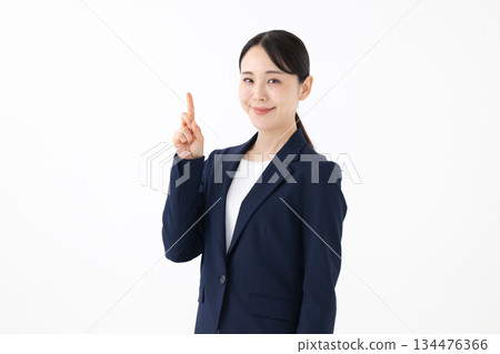 Woman pointing 134476366