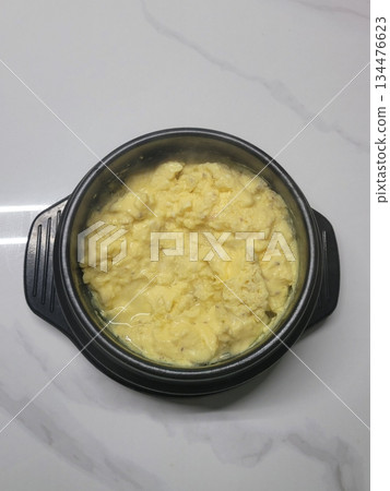 Steamed Korean egg dish, Gyeran Jjim, known for its light, fluffy texture. Served hot, often in an earthenware pot, this savory and comforting dish pairs well with rice and banchan. Steamed Korean egg dish, Gyeran Jjim, known for its light, fluffy texture. Served hot, often in an earthenware pot, this savory and comforting dish pairs well with rice and banchan. 134476623