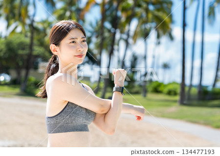 Young woman doing flexibility exercises 134477193