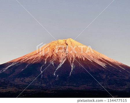 Mount Fuji dyed in the colors of the setting sun 134477515