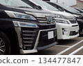 Used car image: Toyota minivans lined up at a dealership 134477847