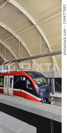 Light Rail Transit or LRT or rail transport system in Indonesia, modern metro train stationed at an urban platform, showcasing efficient public transport 134477993