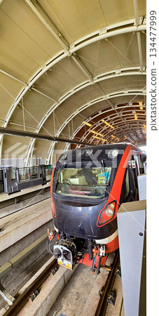 Light Rail Transit or LRT or rail transport system in Indonesia, modern metro train stationed at an urban platform, showcasing efficient public transport 134477999