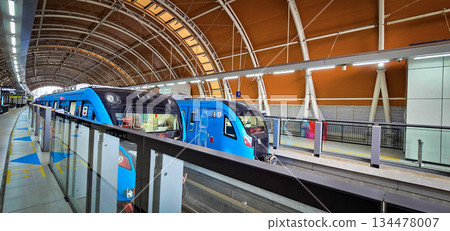 Light Rail Transit or LRT or rail transport system in Indonesia, modern metro train stationed at an urban platform, showcasing efficient public transport Light Rail Transit or LRT or rail transport system in Indonesia, modern metro train stationed at an urban platform, showcasing efficient public transport 134478007