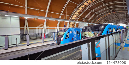 Light Rail Transit or LRT or rail transport system in Indonesia, modern metro train stationed at an urban platform, showcasing efficient public transport 134478008