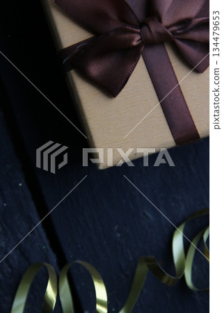 Gift box with ribbon On vintage background. Gift box with ribbon On vintage background. 134479653