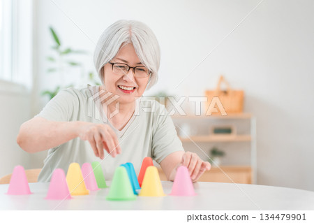 Senior woman training in rehabilitation (stroke, hemiplegia, sequelae) 134479901