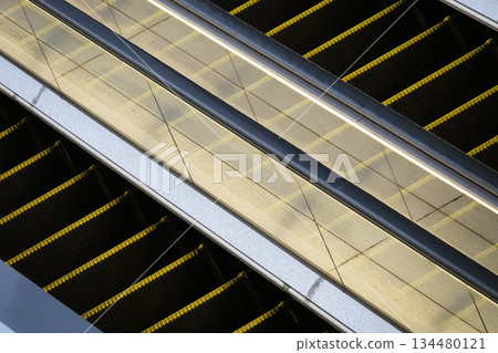 Outdoor escalators installed between commercial buildings Outdoor escalators installed between commercial buildings 134480121