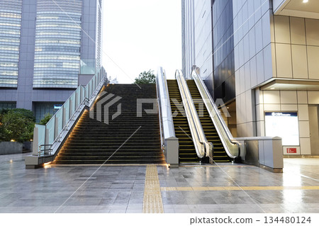 Outdoor escalators installed between commercial buildings Outdoor escalators installed between commercial buildings 134480124