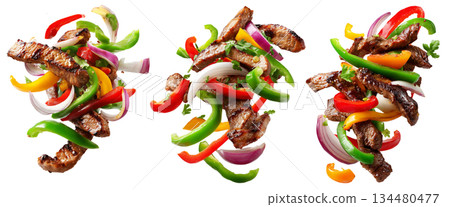 Tex-Mex Fajitas grilled beef strips with bell peppers and onion slices isolated on white background, concept of fresh grilled food Tex-Mex Fajitas grilled beef strips with bell peppers and onion slices isolated on white background, concept of fresh grilled food 134480477