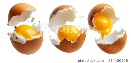 Cracked brown egg with intact yolk and broken shell in high detail, isolated on white transparent background 134480526