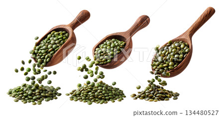 Green lentils falling from rustic wooden scoop, isolated on white background, concept of natural food and legumes 134480527