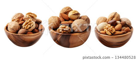 Assorted walnuts and almonds in natural wood bowl with some nuts floating above, isolated on white background 134480528