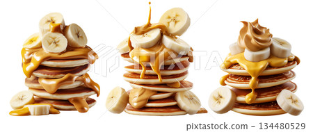 Stack of pancakes topped with banana slices and peanut butter splash isolated on white transparent background 134480529