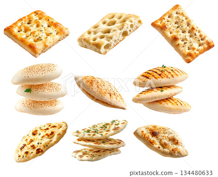 Various types of flatbreads and pita breads arranged on white background, showing texture and variety, concept of traditional food 134480633